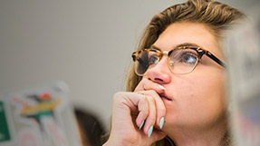a student listens to a course lecture