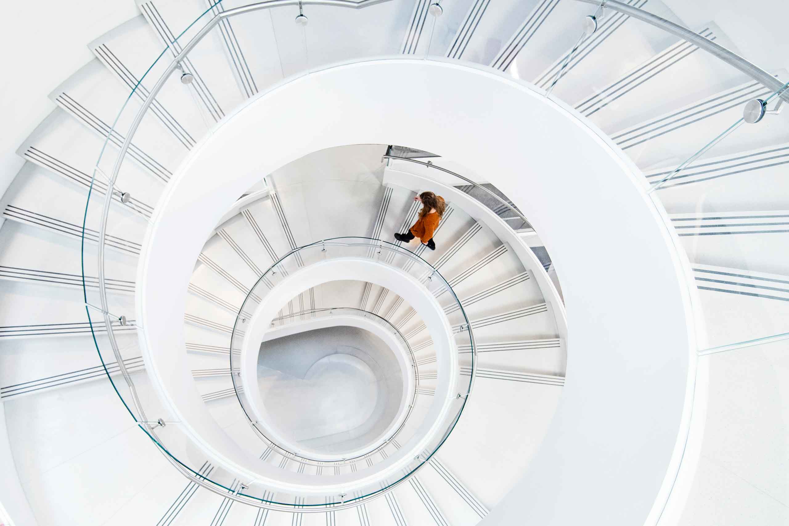 a view looking down at ISEC's spiral staircase