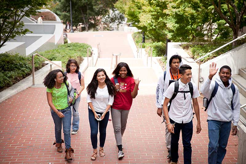 SMASH students walk through a college campus. Image of students provided by SMASH Academy (smash.org).
