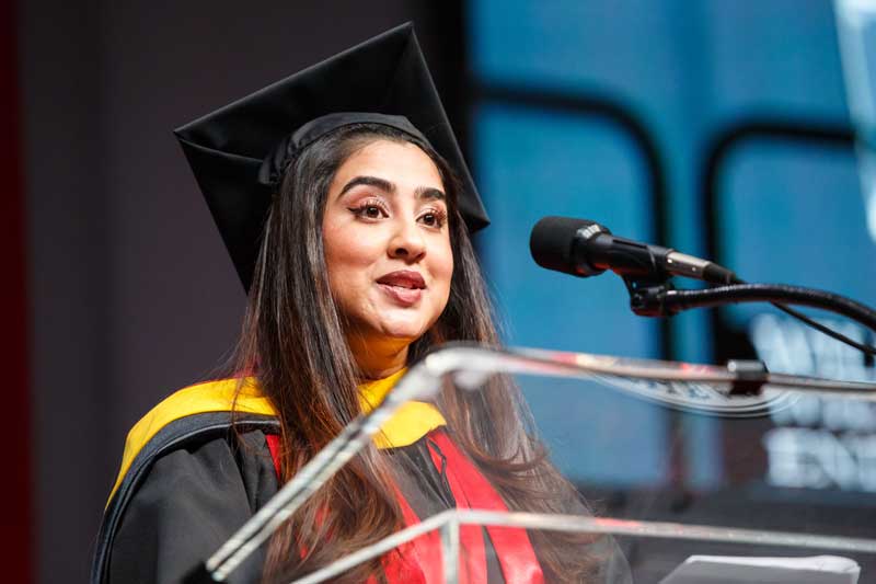 Khoury graduate speaker Devina Raithatha speaks to graduates