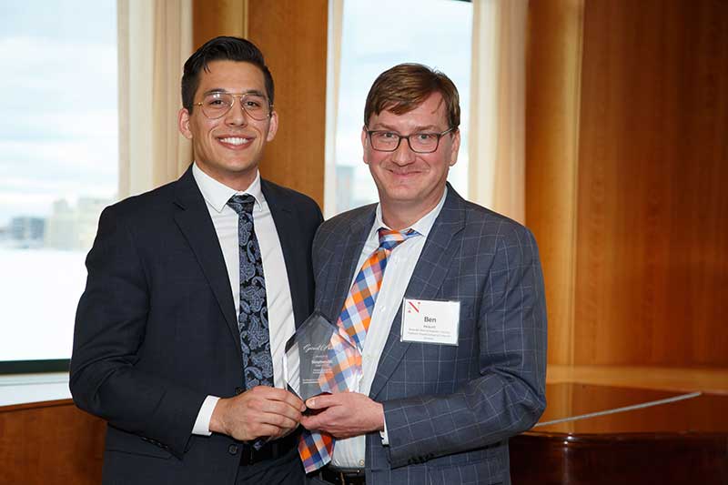 Associate Dean of Undergraduate Education and Experience Ben Hescott presents Alt with the Garnet Award in 2019. The award, part of Northeastern’s signature Compass Awards Program, recognizes a third-year undergraduate who positively impacts the school community and shows immense promise.