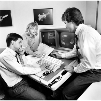 THree students work in a Northeastern lab during the 1980s