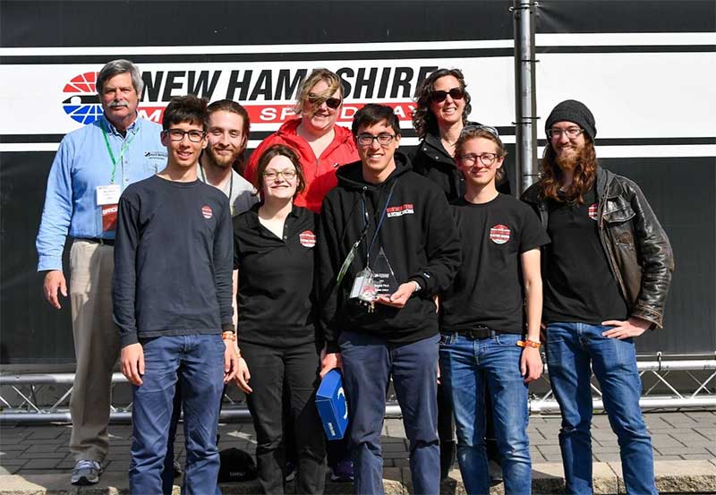 James Chang-Davidson (center front) and a few of his teammates pose with the inaugural Scrutineers’ Award, given in memory of trailblazing Formula One scrutineer Suzanne Royce.