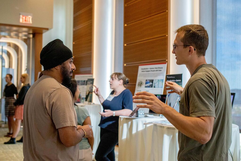 Research poster sessions generate lively conversation.