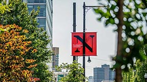 A Northeastern banner hanging from a light pole