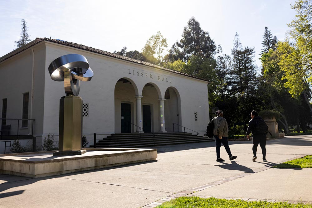 Northeastern students walk on a path at Mills College on June 11, 2022. Photo by Ruby Wallau for Northeastern University