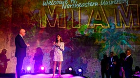 People speak on a stage at Northeastern's Miami campus kick-off event