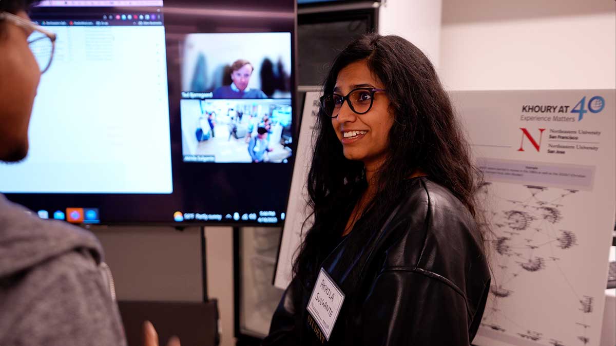 A student presents a research poster at the 40th anniversary celebration at Silicon Valley