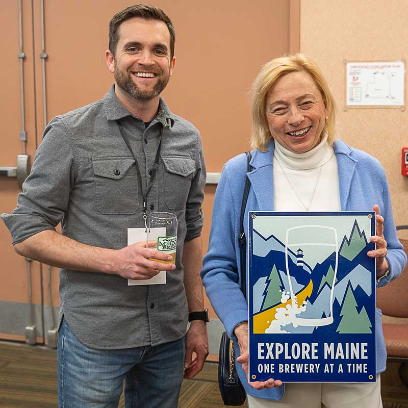 Align student Sean Sullivan (left) poses with Maine Governor Janet Mills at the New England Craft Brew Summit.