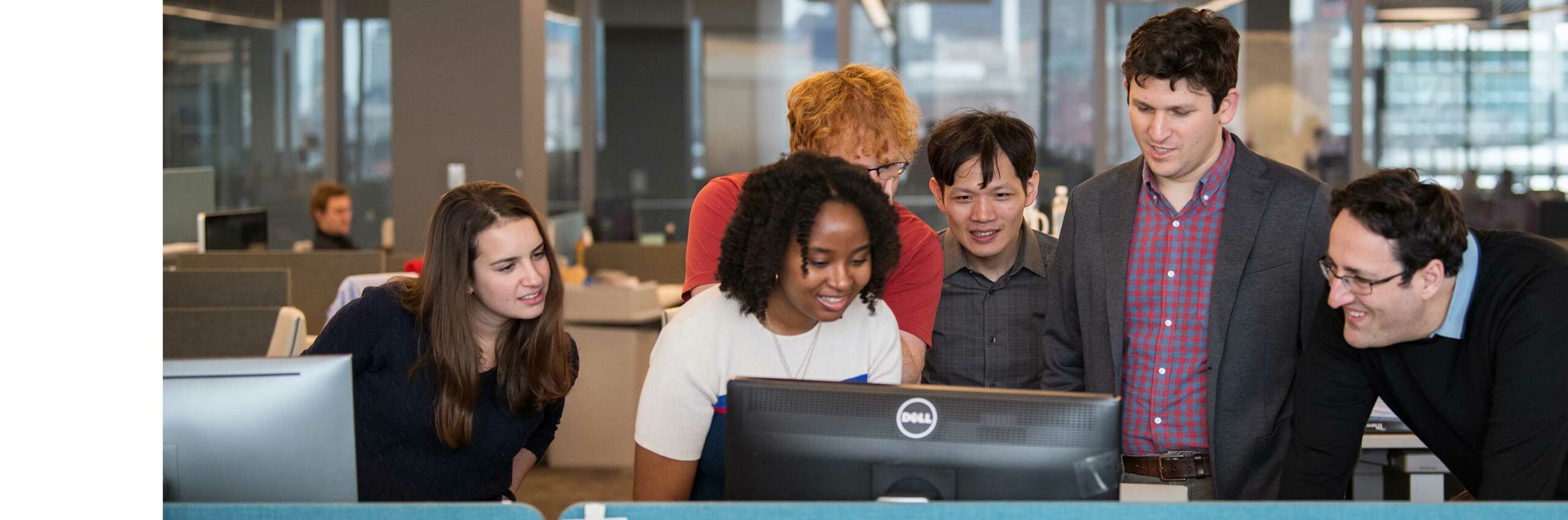 Northeastern students and faculty members view research results on a computer.