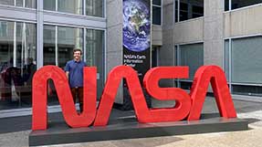 Owen Seltzer stands outside a NASA building. Photo credit: NASA SCaN on X