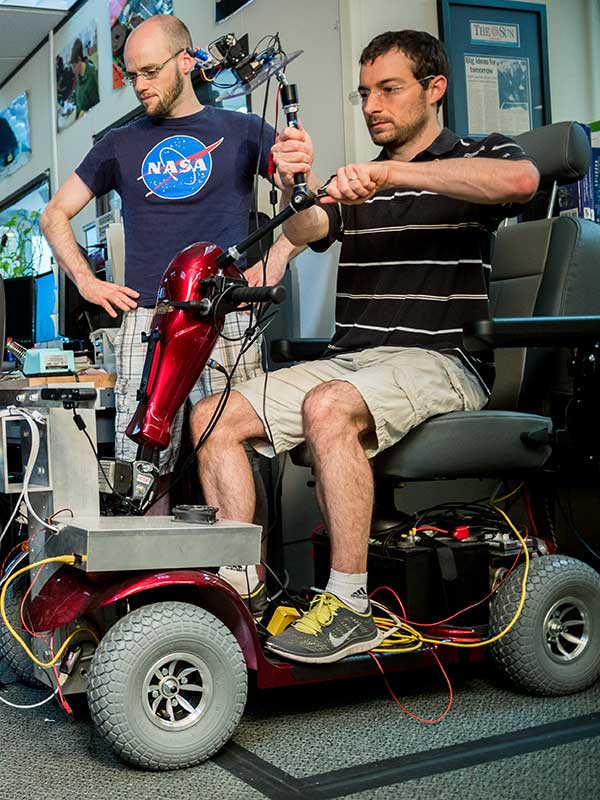 Northeastern researchers work on a robotic wheelchair.