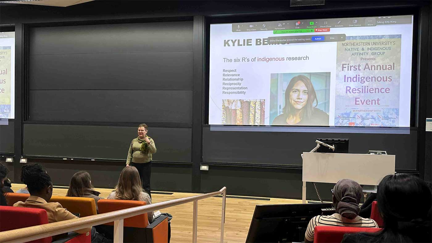 Dean Beth Mynatt presents a slide about Khoury faculty member Kylie Bemis