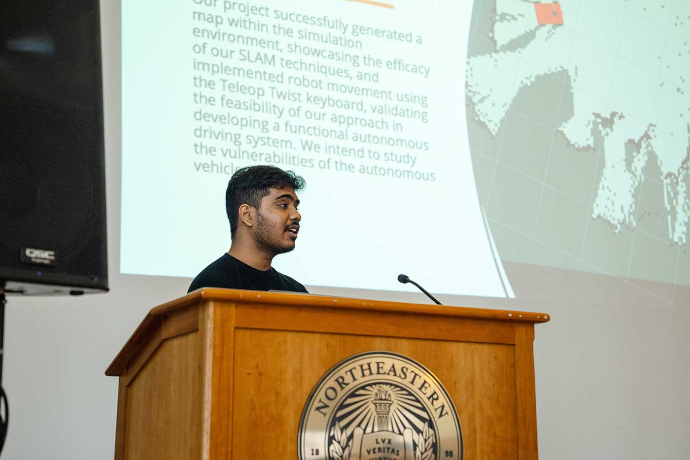 Kaushik Boora presents research at a podium