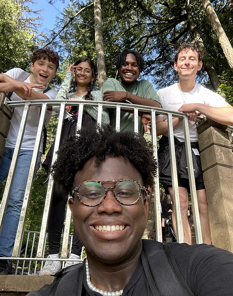 Khoury interns pose for a selfie during a hike in a Seattle forest