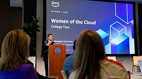 Dean of the Khoury College of Computer Sciences Elizabeth Mynatt delivers her opening remarks standing behind a podium